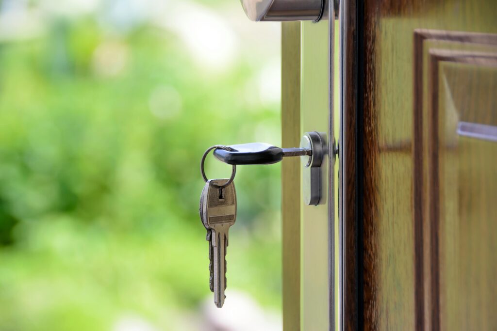 Key In Door Of Modern Home – Santa Monica Real Estate Property Entry Symbolizing New Homeownership Opportunities.